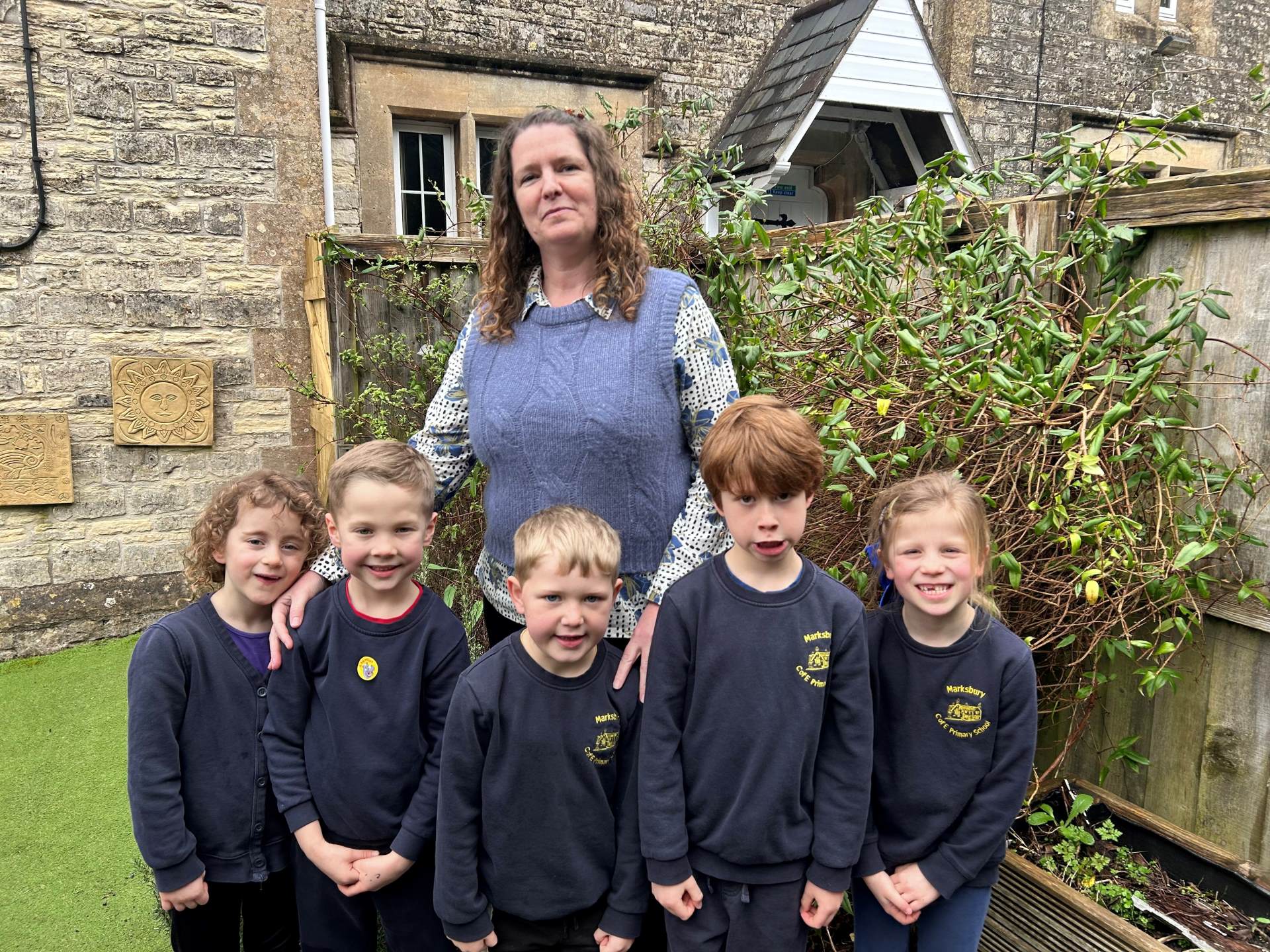 Amanda Trim, new Headteacher at Marksbury woman with school children